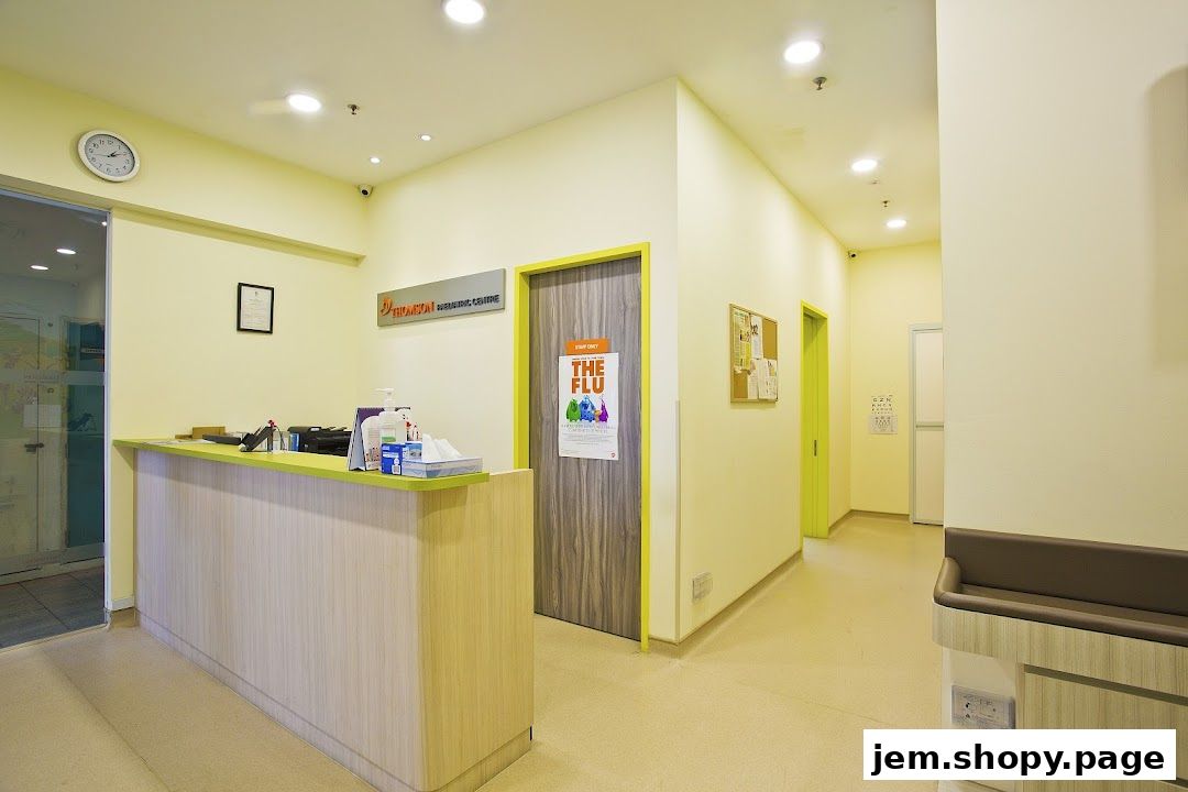 Interior view of a pediatric clinic reception area with a counter and hallway.