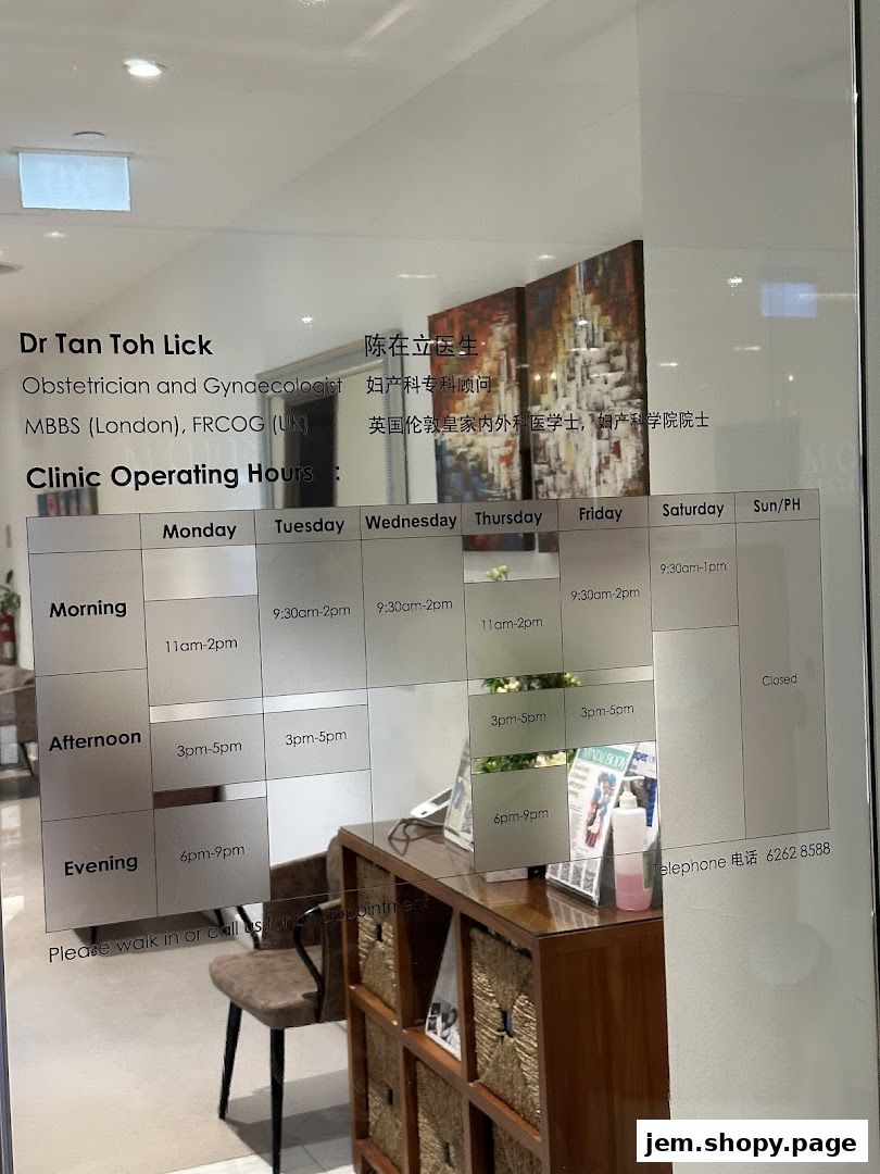 Clinic operating hours and doctor's details displayed on a glass door.