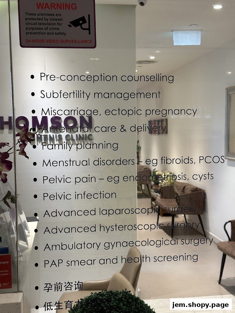 A list of women's health services offered at Thomson Women's Clinic is displayed on a glass door.