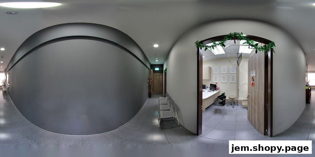 Interior view of a clinic hallway with a reception area visible through an open doorway.