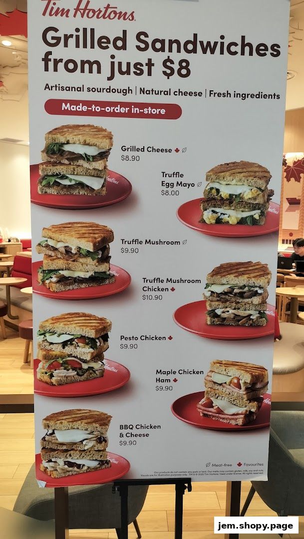 A menu board showcasing Tim Hortons' grilled sandwiches with prices and images.