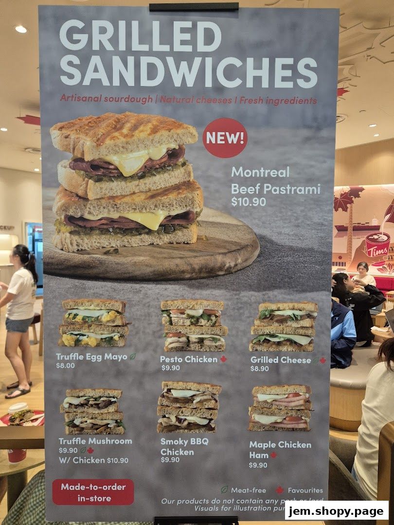 A menu board showcasing various grilled sandwiches offered by Tim Hortons.