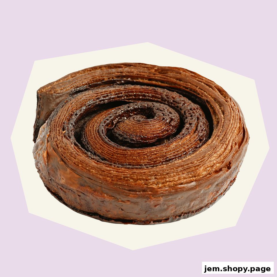 A close-up shot of a delicious chocolate croissant swirl pastry.