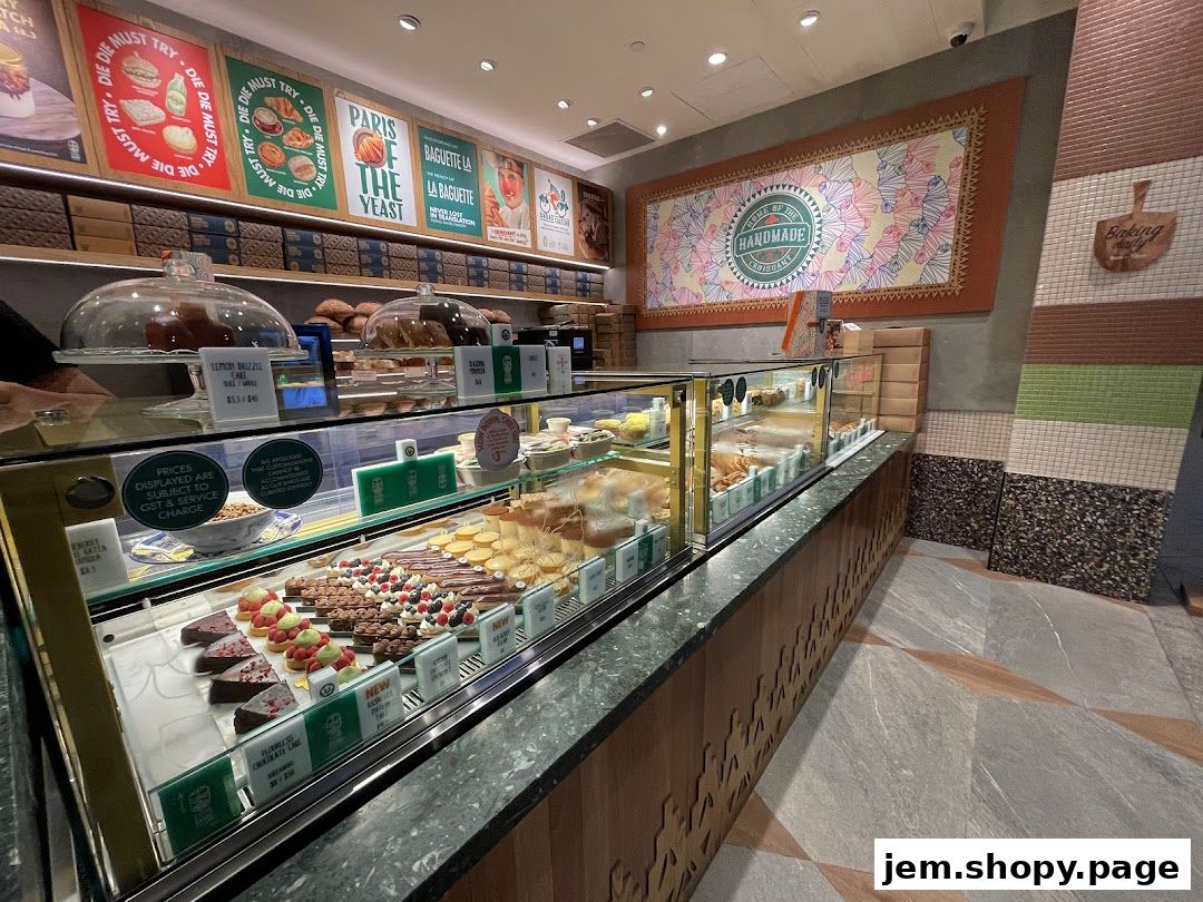 A display case filled with various pastries and cakes at Tiong Bahru Bakery.