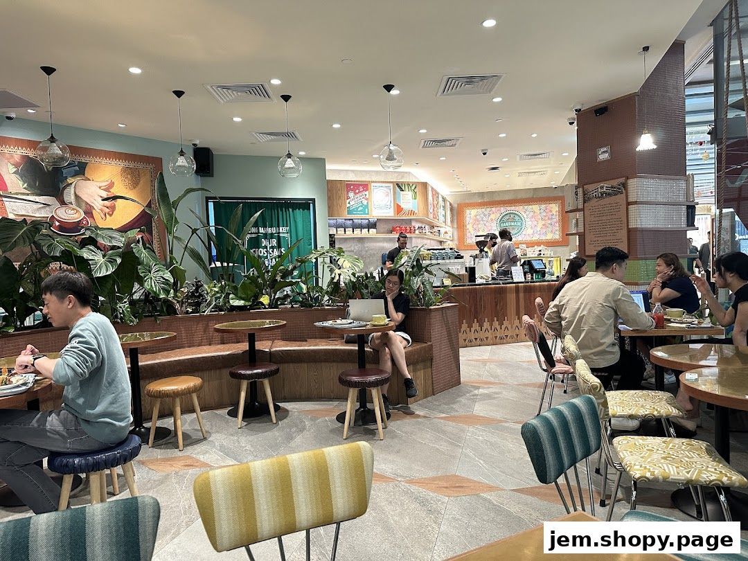 Interior of Tiong Bahru Bakery with patrons dining and staff serving.