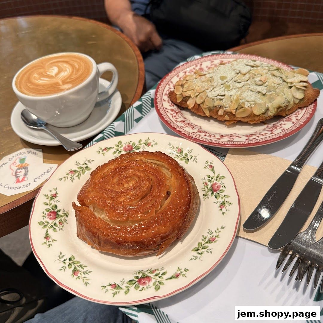 A delicious coffee and pastries are served on a table at Tiong Bahru Bakery.