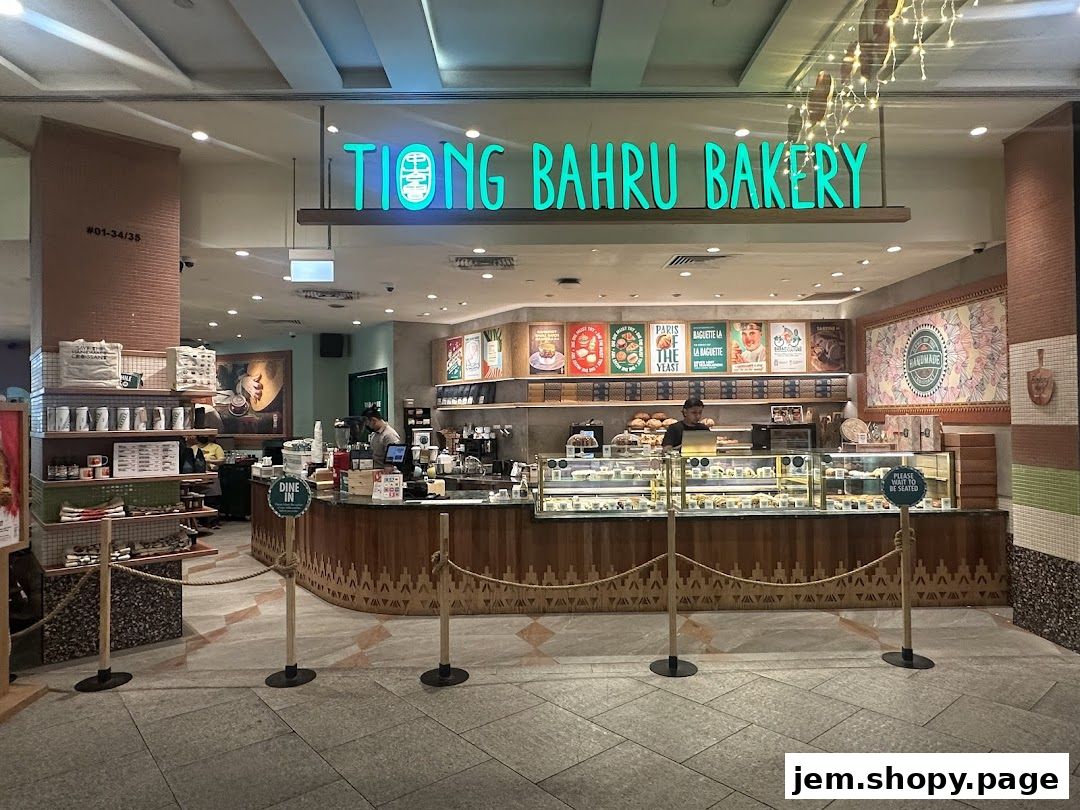 The exterior of Tiong Bahru Bakery, showcasing its display cases filled with pastries and baked goods.