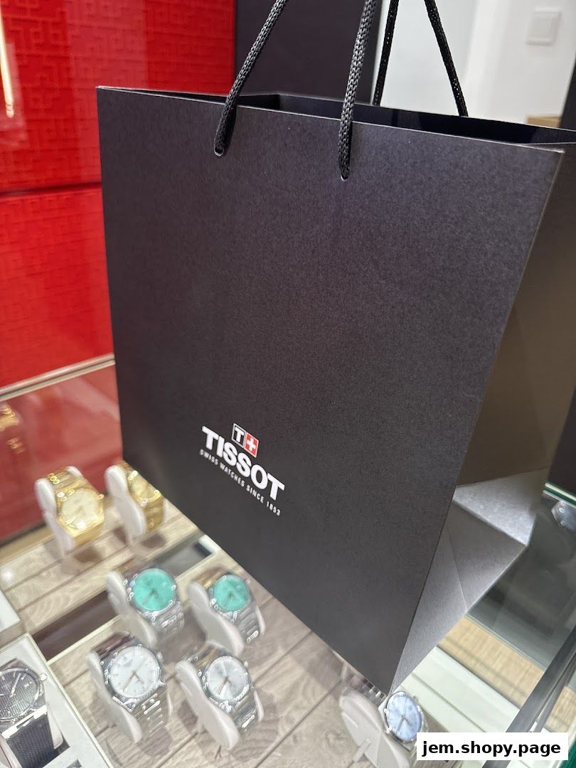 A Tissot shopping bag with watches displayed in a glass case.