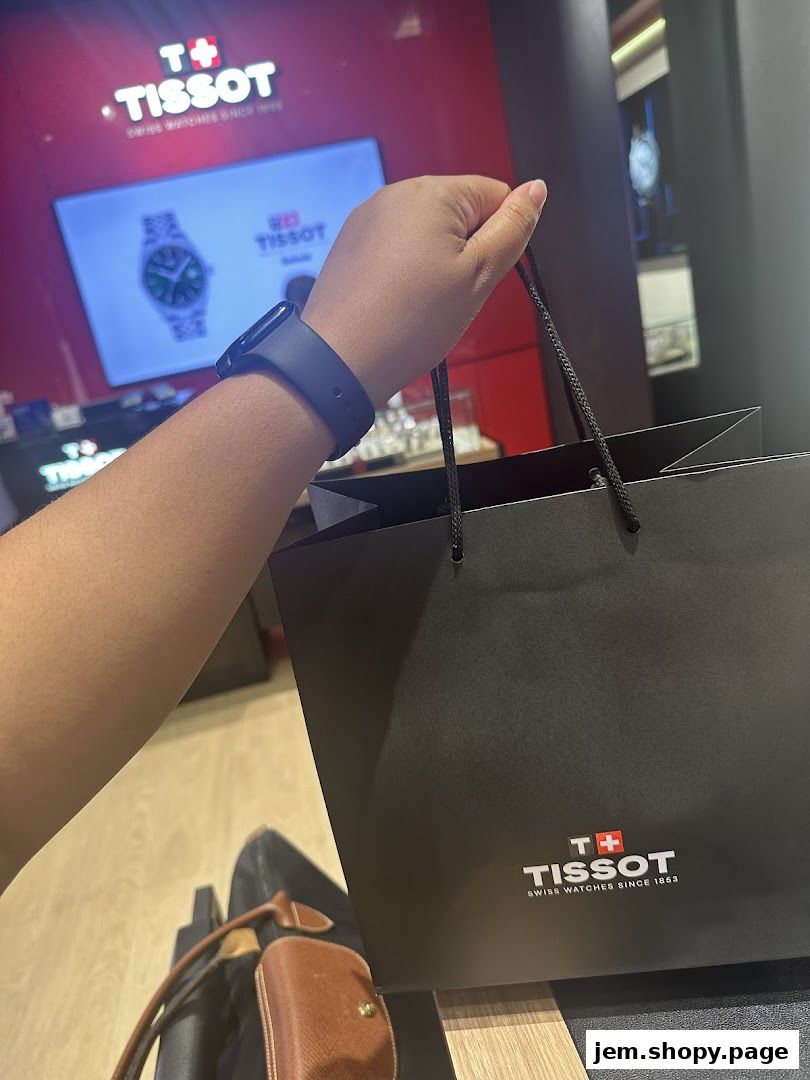 A person holds a Tissot shopping bag inside a Tissot watch store.