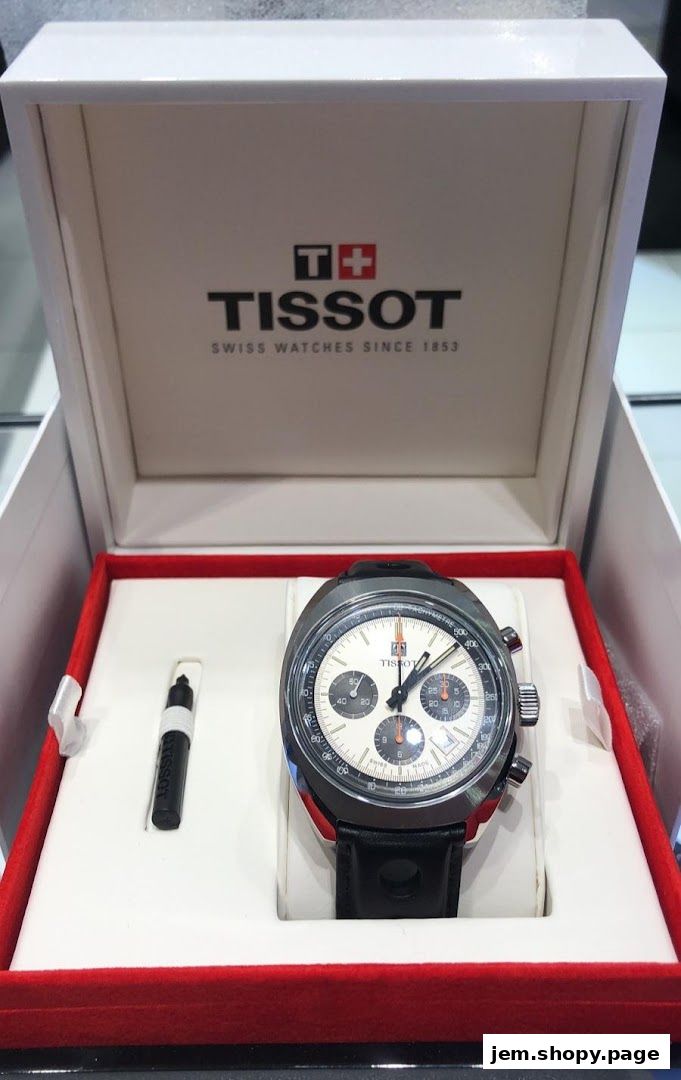A Tissot watch in its presentation box with the brand logo visible.