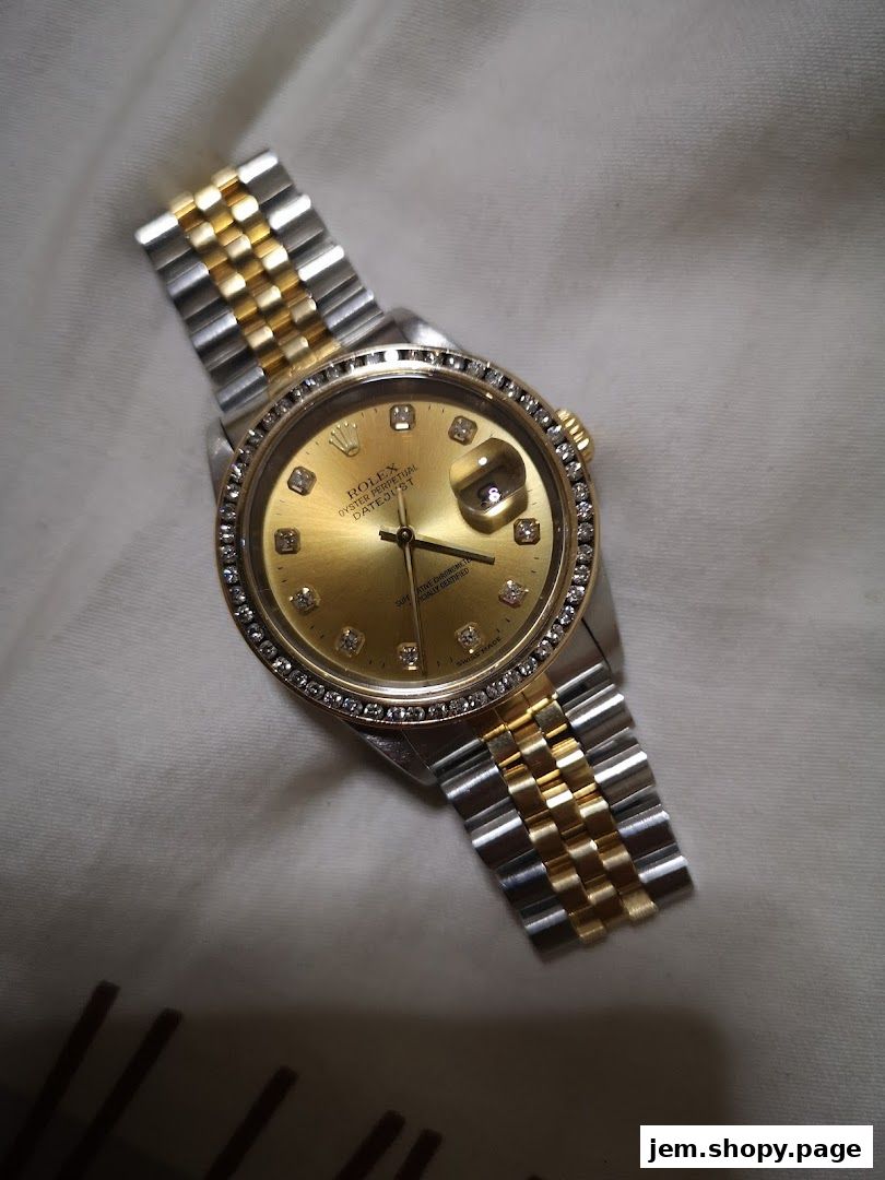 A close-up shot of a gold and silver Rolex watch with diamond markers.