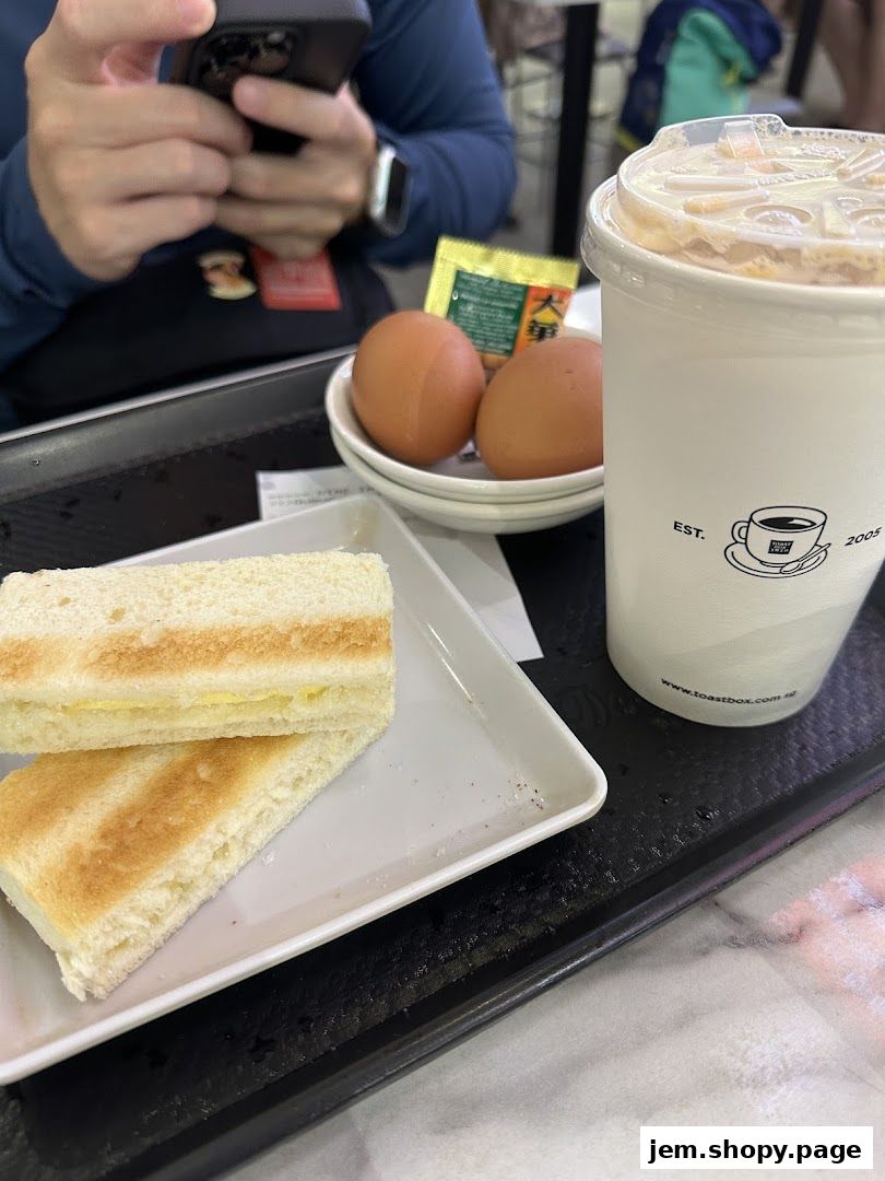 A tray with toast, eggs, and a drink from Toast Box.