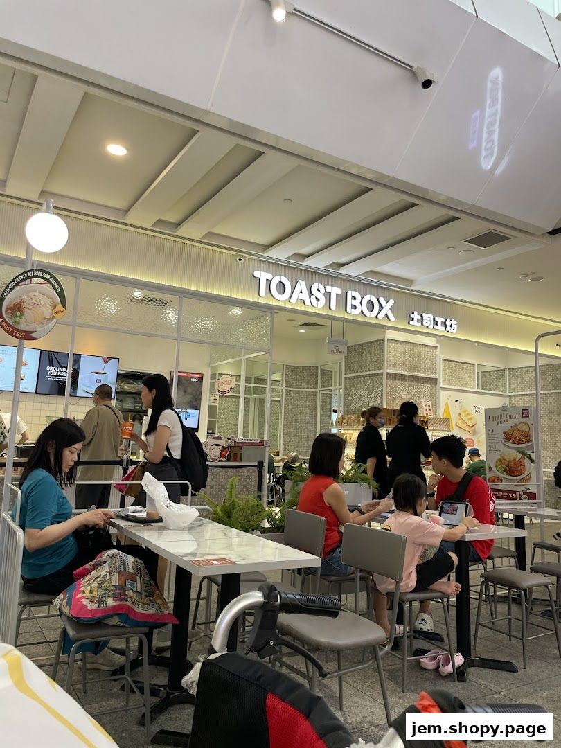 People dining at Toast Box, a casual eatery with a clean, modern interior.
