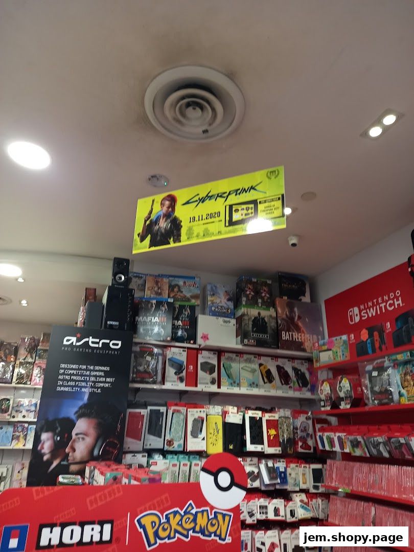 Interior of a gaming store with shelves stocked with video games and accessories.