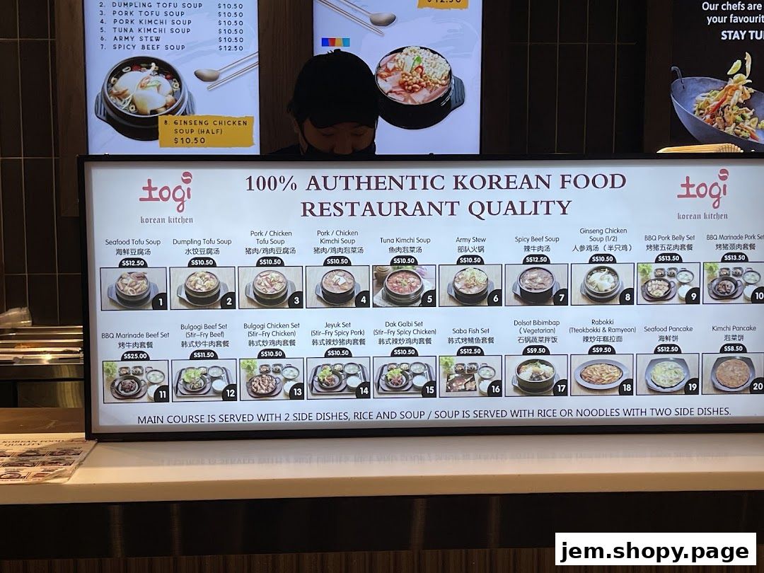 A menu board for Togi Korean Kitchen, showcasing various Korean dishes with prices.