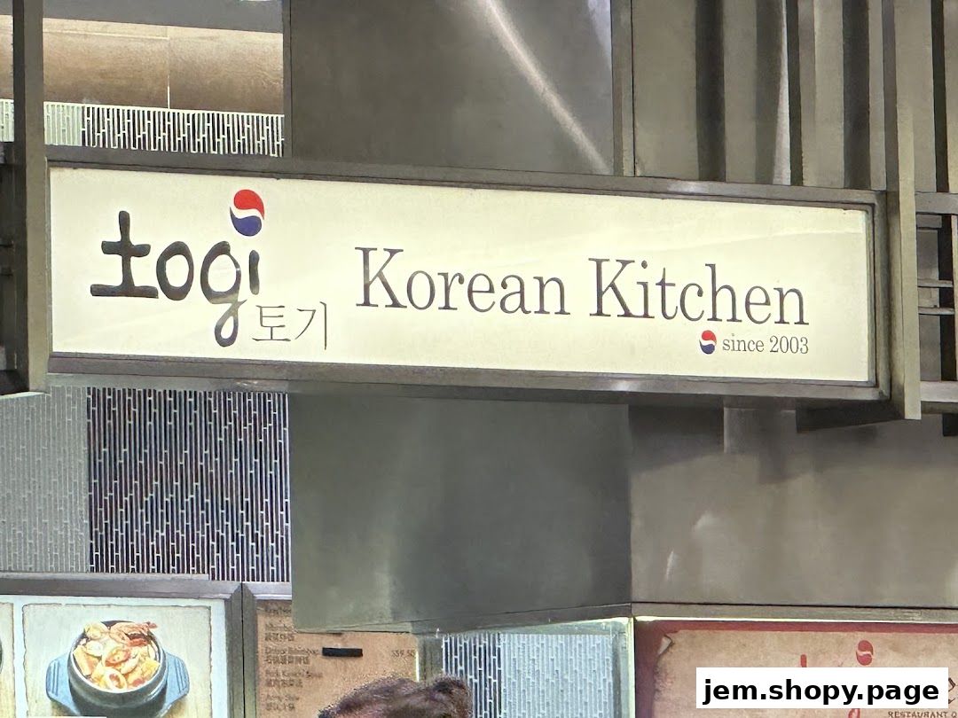 A sign for Togi Korean Kitchen, established in 2003, with Korean and English text.