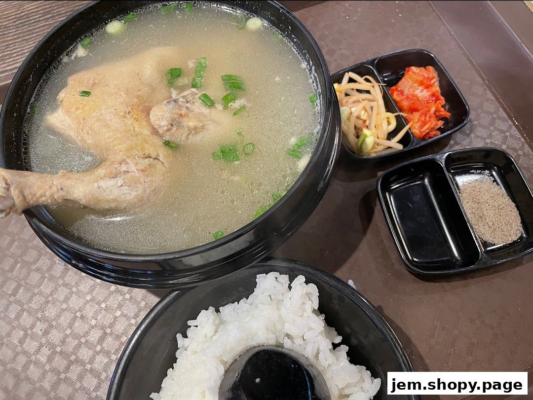 A hearty Korean chicken soup with rice, kimchi, and bean sprouts.