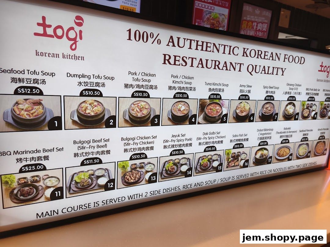 A brightly lit menu board for Togi Korean Kitchen, showcasing various Korean dishes with images and prices.
