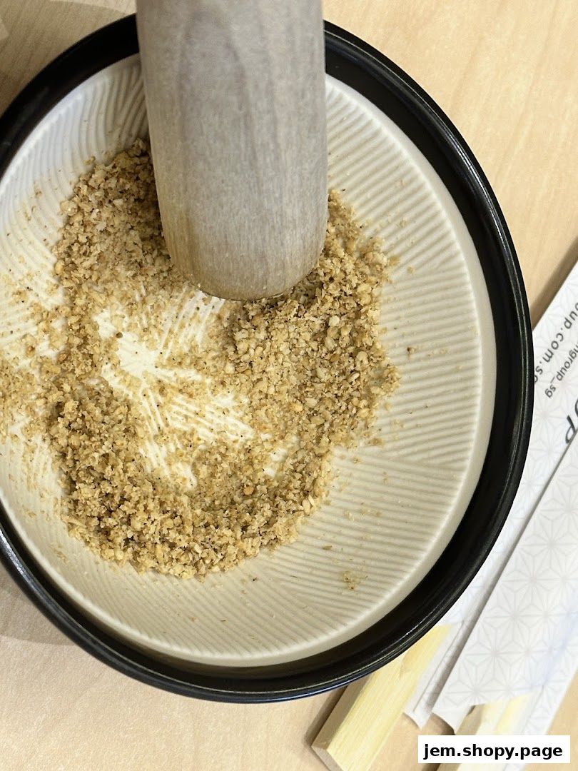 A mortar and pestle grinding sesame seeds for a delicious meal.