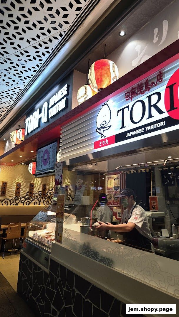 TORI-Q JAPANESE YAKITORI shop front with staff preparing food behind the counter.