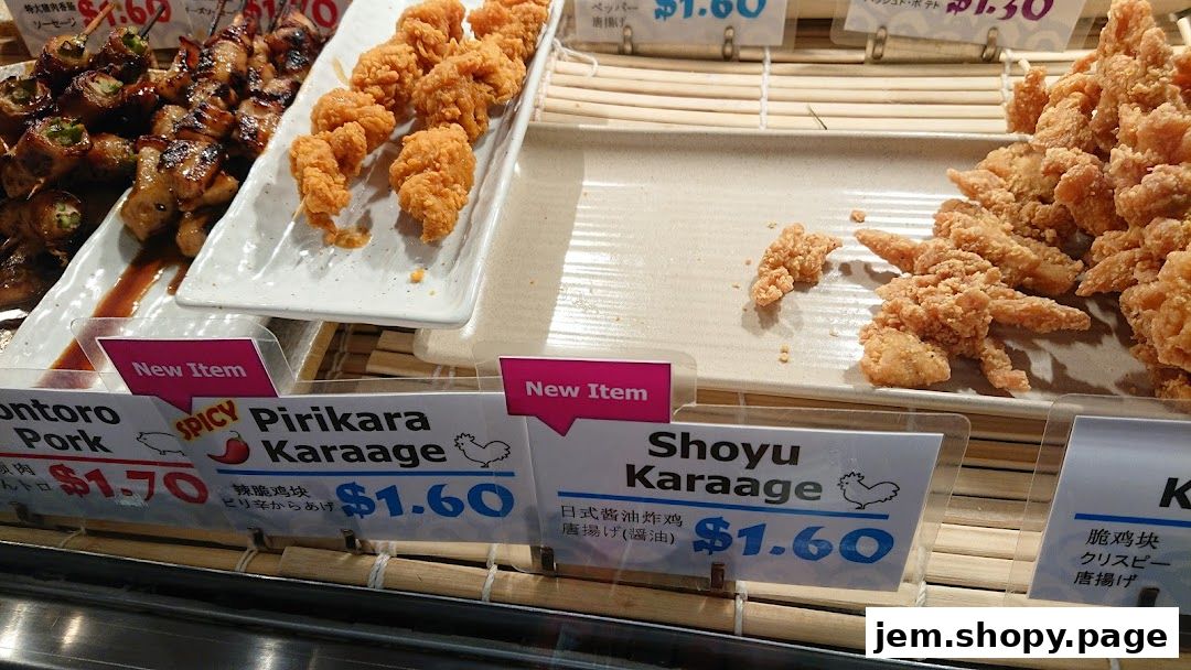 A display of various fried chicken and pork skewers with price labels.