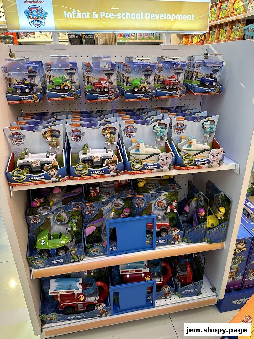 Shelves stocked with Paw Patrol toys, featuring vehicles and figures for young children.