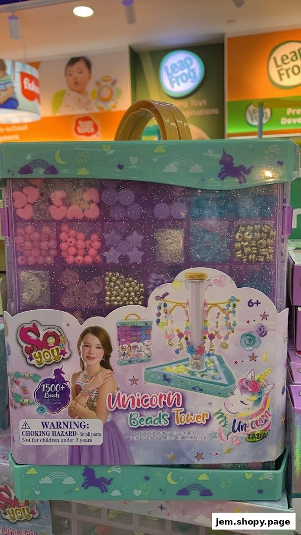 A close-up of a 'Unicorn Beads Tower' toy kit with various beads and charms.