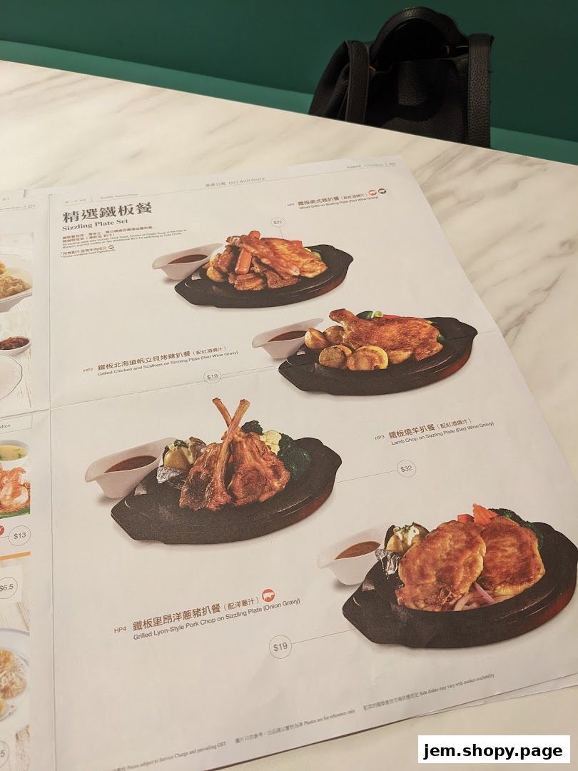 A menu page from Tsui Wah featuring sizzling plate sets with various meat and seafood options.