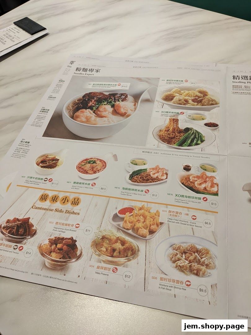 A menu from Tsui Wah featuring noodles, wontons, and Cantonese side dishes.