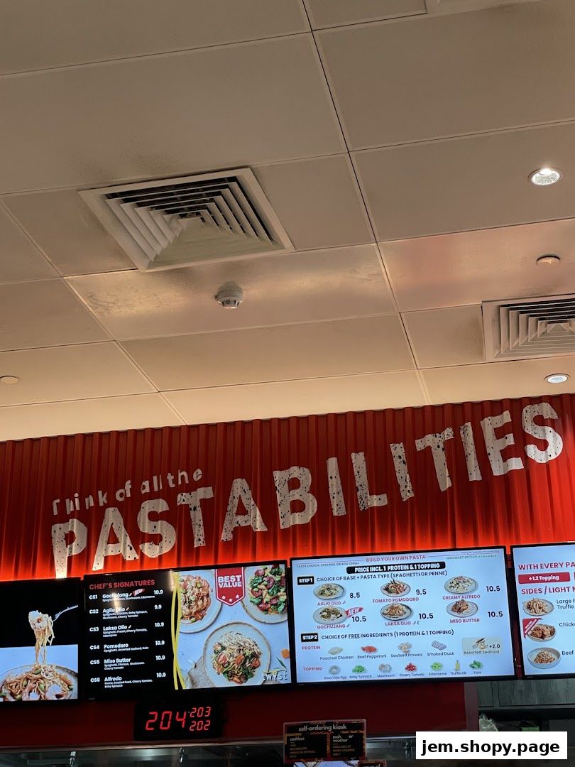 A digital menu board displaying pasta options and prices at Twyst.