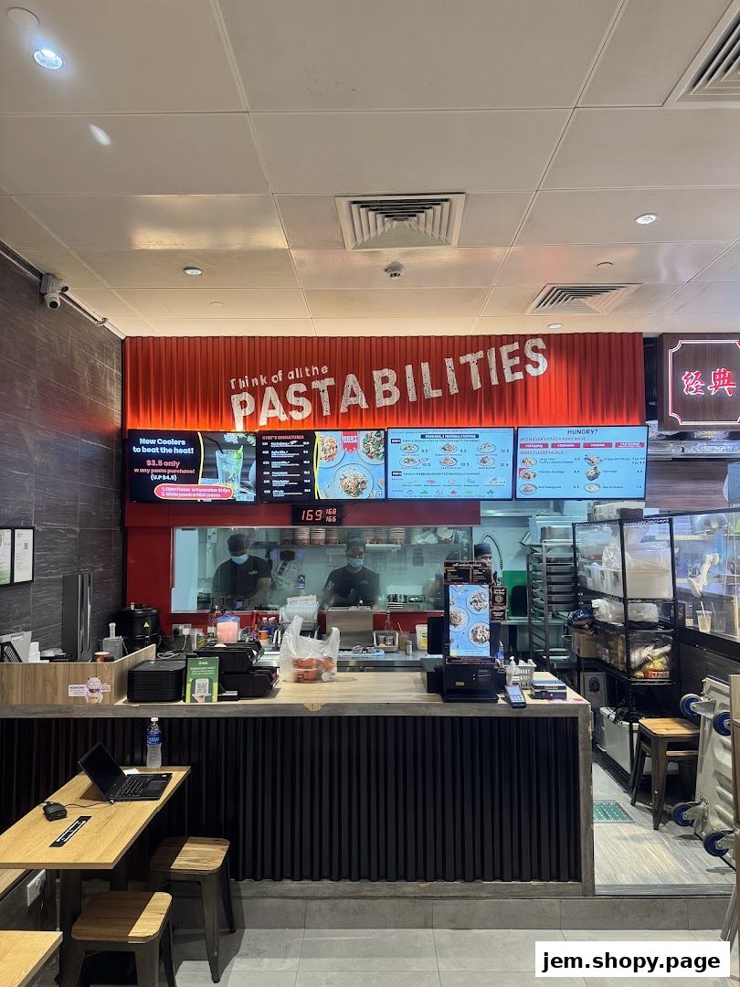 A pasta restaurant with a digital menu displaying various pasta dishes and drinks.