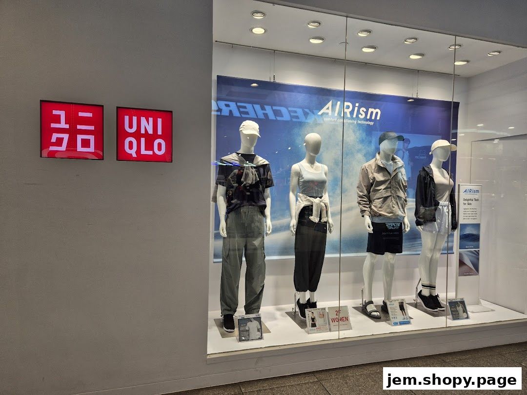 UNIQLO store window display featuring mannequins in casual outfits and AIRism technology.