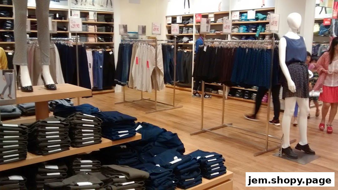Interior view of a UNIQLO store showcasing folded pants and clothing racks.