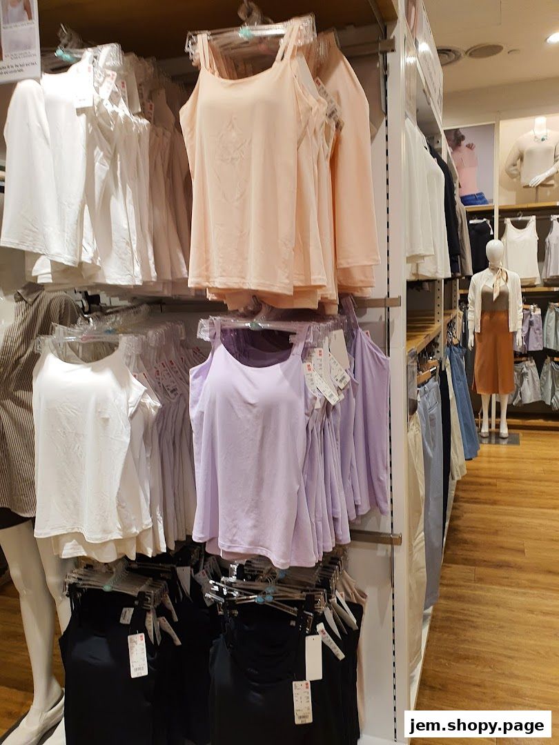 Interior view of a UNIQLO store showcasing various women's tops and undergarments.