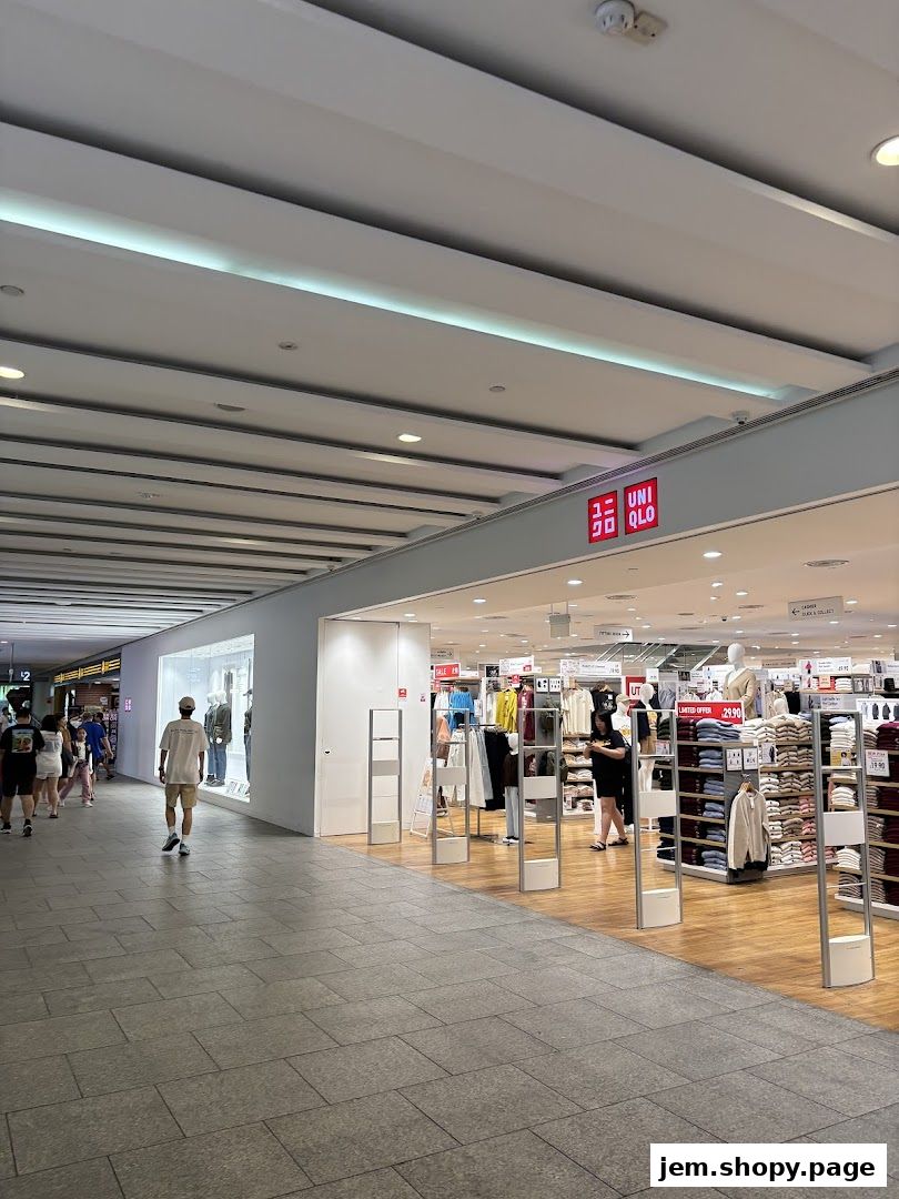The entrance to a UNIQLO store with clothing displays and mannequins visible.
