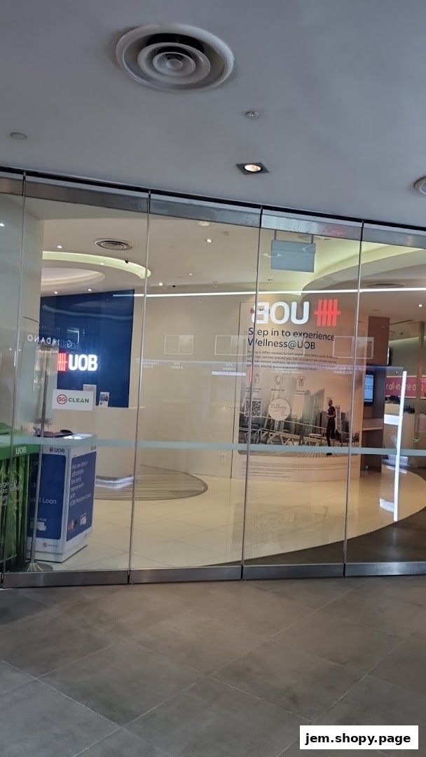 The entrance to the UOB Wealth Banking Centre at Jem, featuring glass doors and branding.