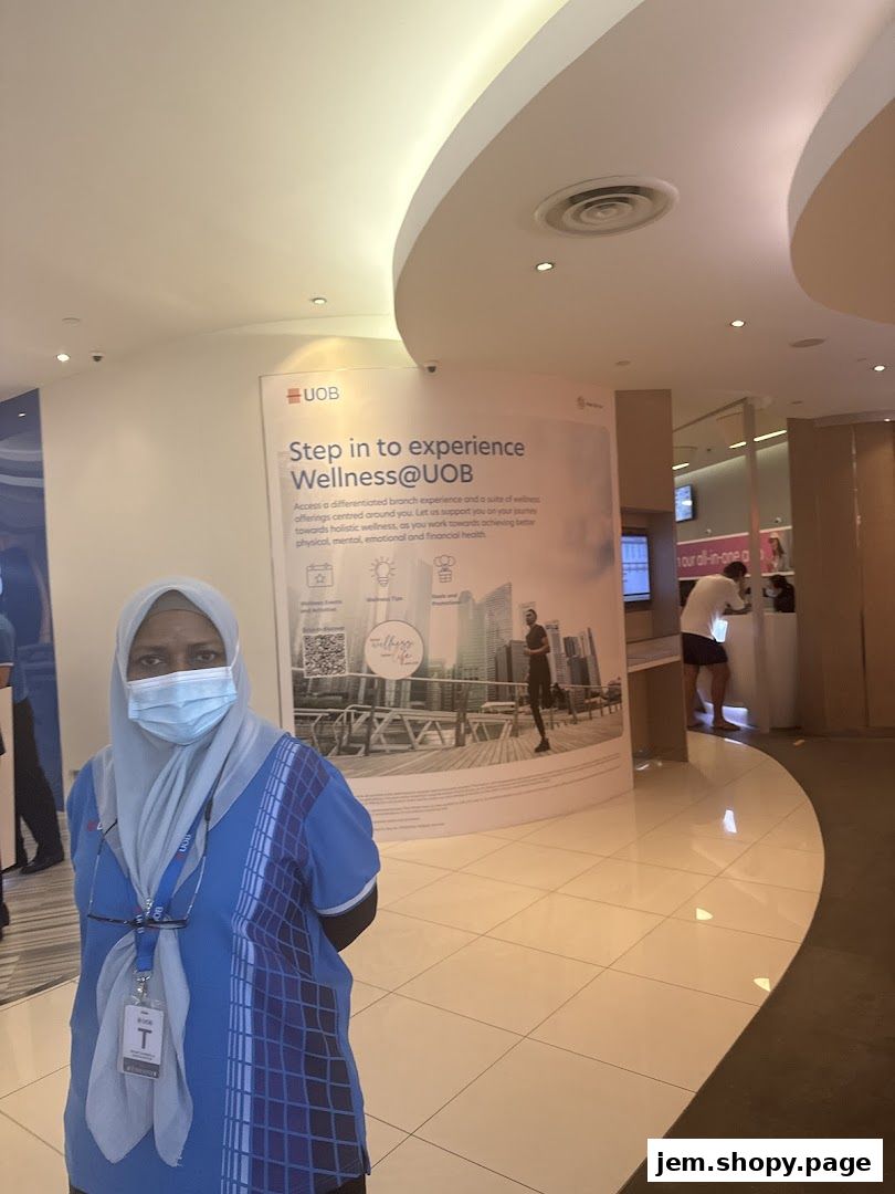 A UOB branch interior with a promotional banner about wellness and staff members.