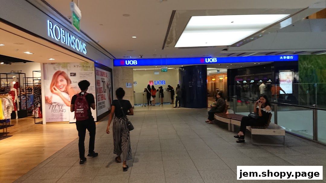 Interior view of a shopping mall with UOB bank and Robinsons store visible.
