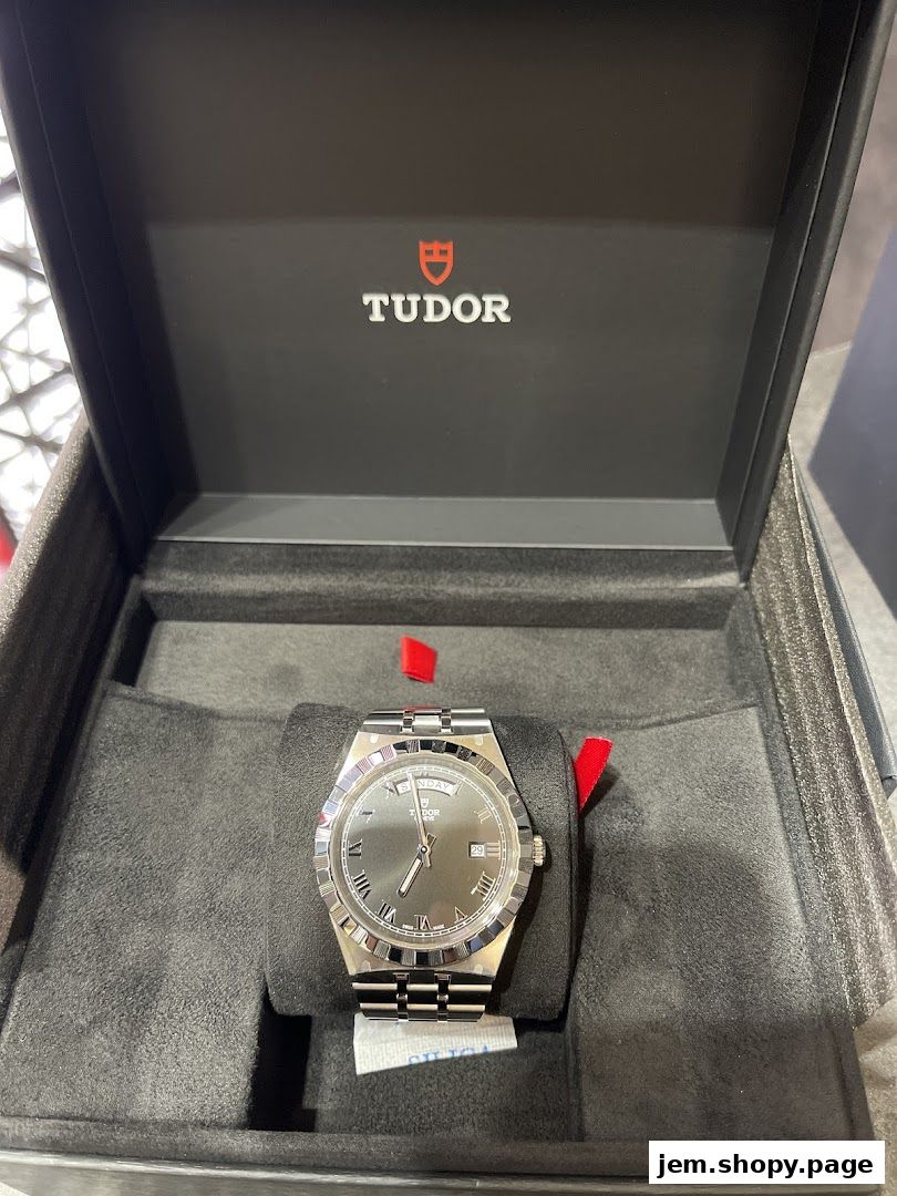 A Tudor watch displayed in its official presentation box.