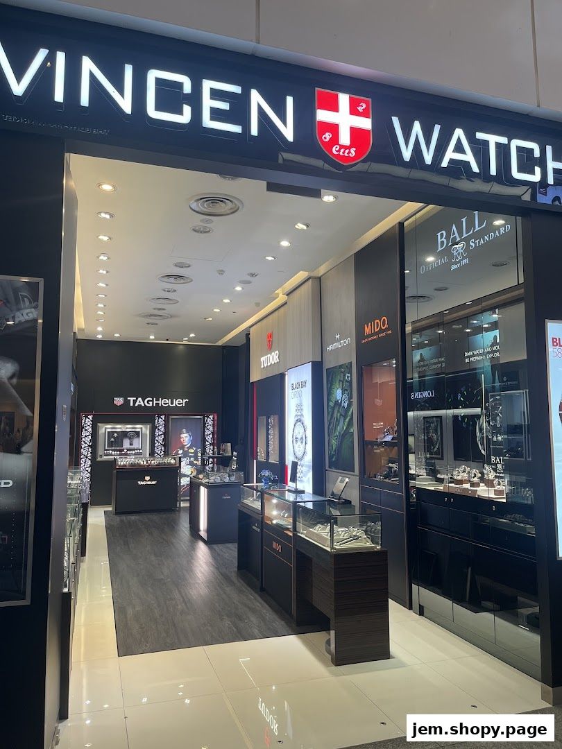 A well-lit watch retailer showcasing brands like Tudor, TAG Heuer, and Longines.
