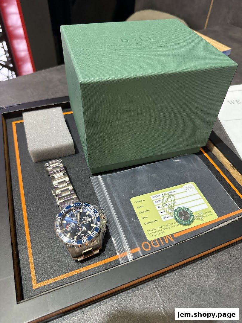 A luxury watch with its box and certification displayed.