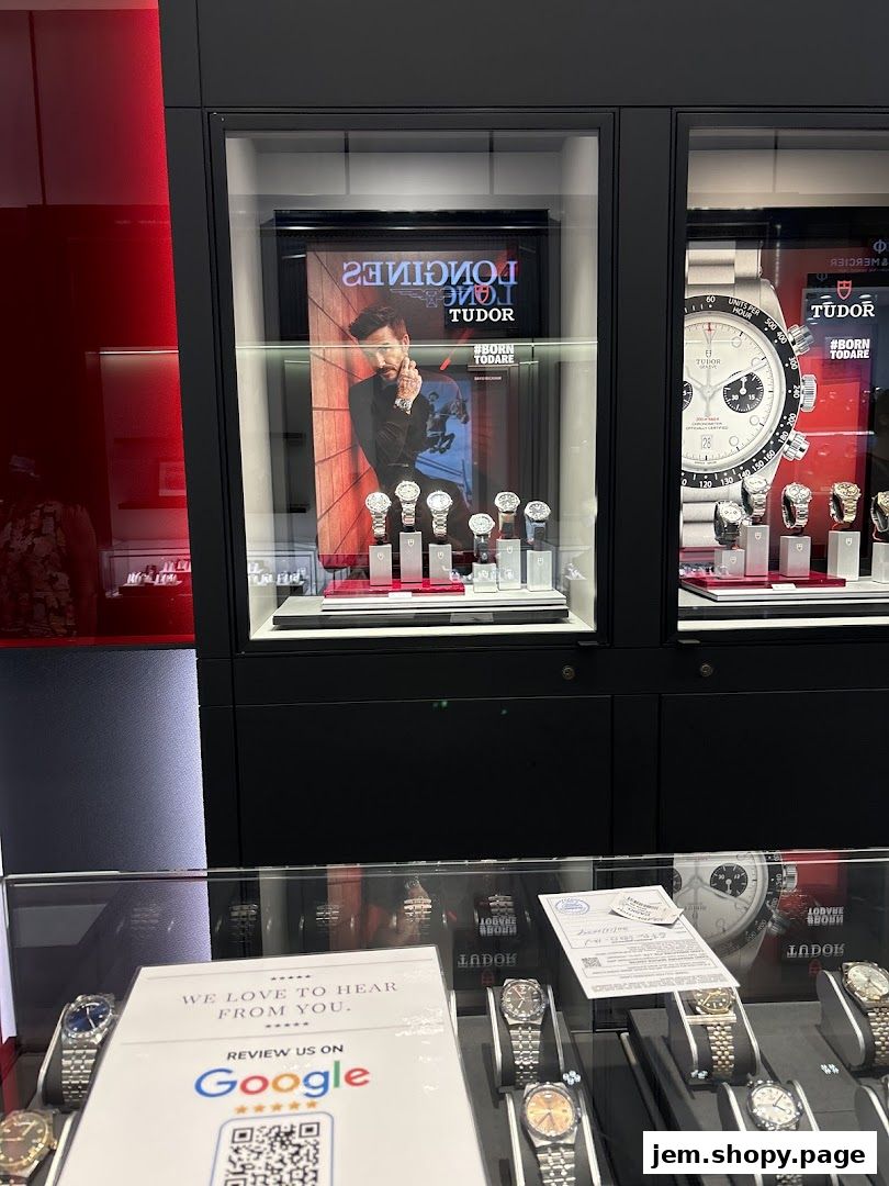 A display window showcasing Tudor and Longines watches with promotional posters.