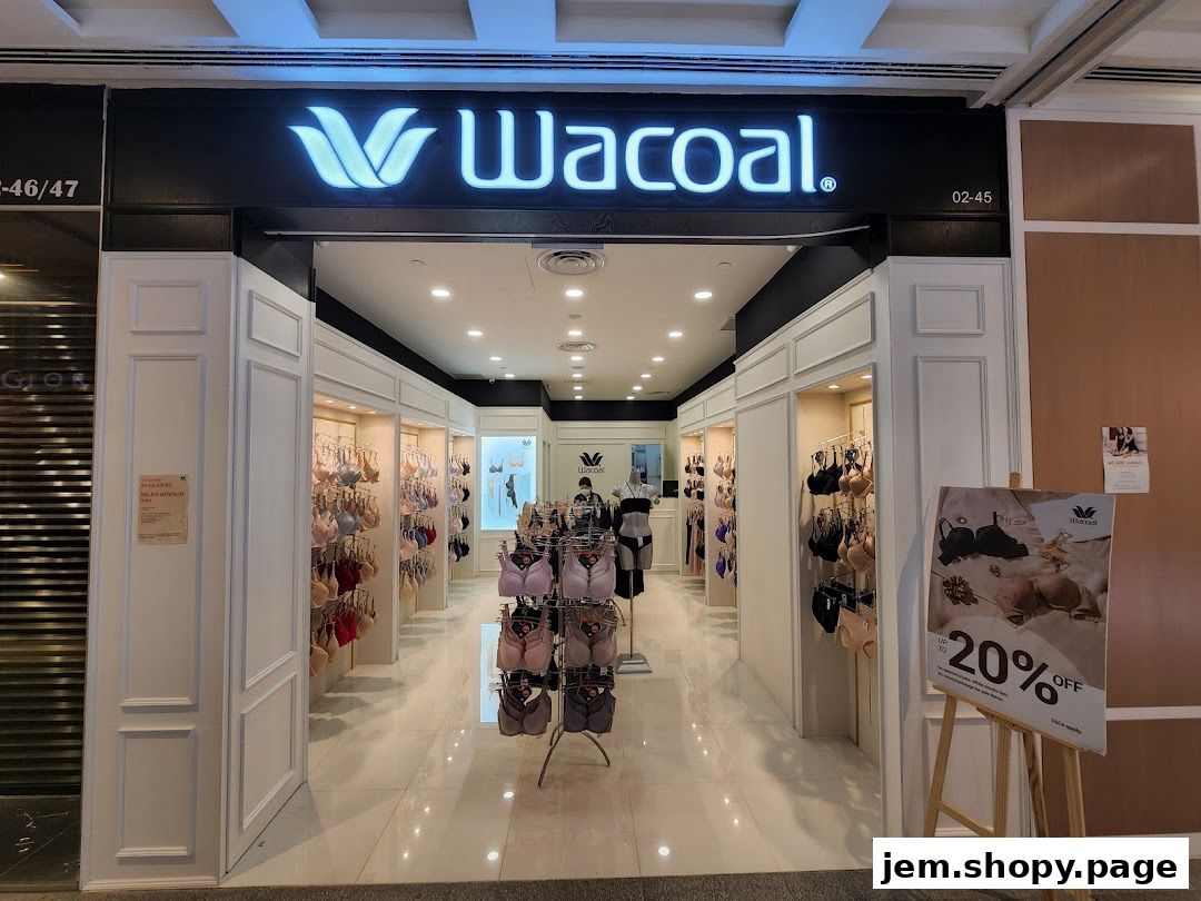 The entrance of a Wacoal lingerie shop displaying bras and a 20% off sale sign.