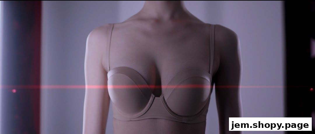 A close-up shot of a woman wearing a beige strapless bra with thin straps.