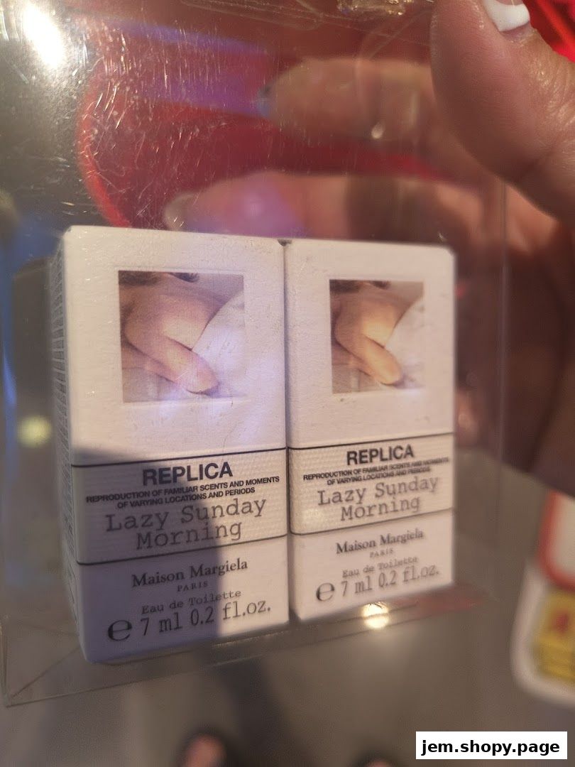 Two miniature bottles of Maison Margiela 'Lazy Sunday Morning' Eau de Toilette.