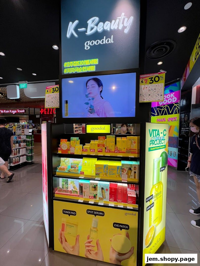 A display of Goodal K-Beauty products featuring serums, toners, and eye patches.