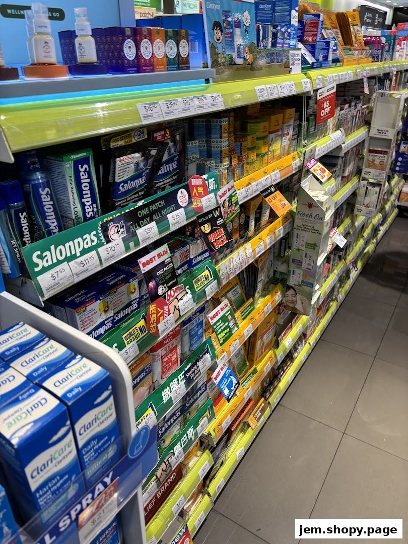 A wide aisle of a pharmacy store displaying various health and personal care products on shelves.