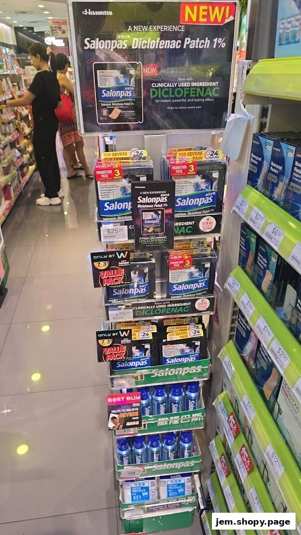 A display of Salonpas Diclofenac patches and other pain relief products in a pharmacy.