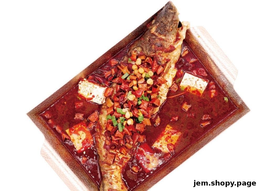 A whole fish dish in a spicy red sauce with tofu and chili peppers.