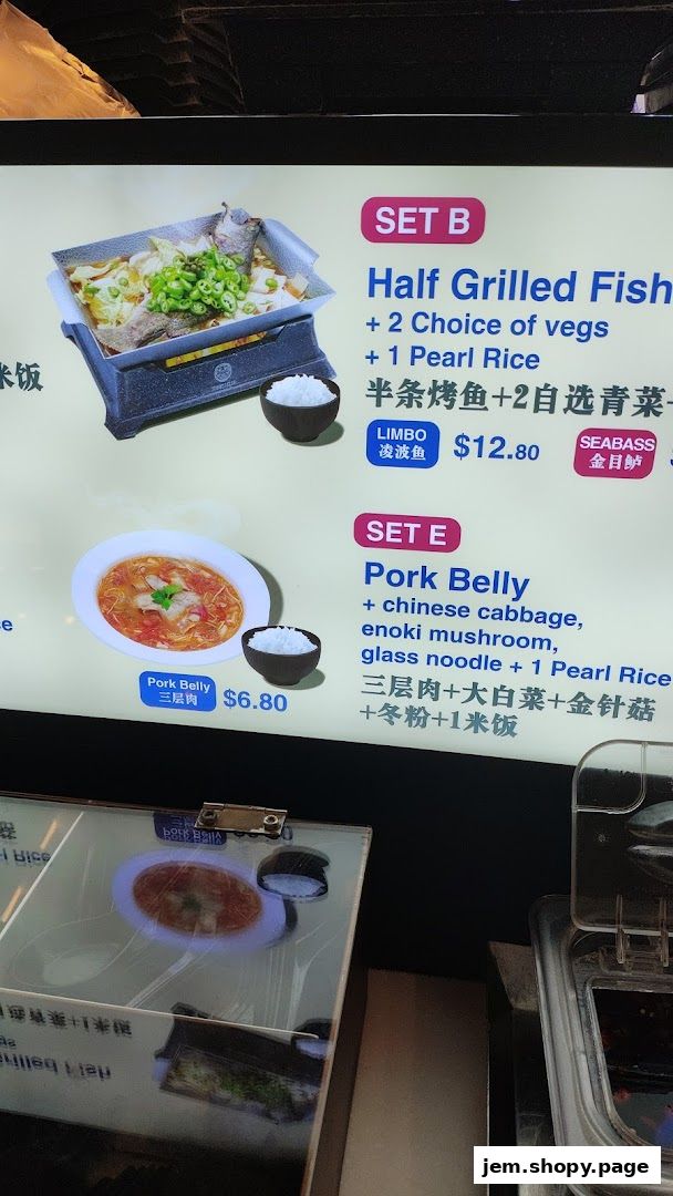 A menu display showing two set meals: Half Grilled Fish and Pork Belly.